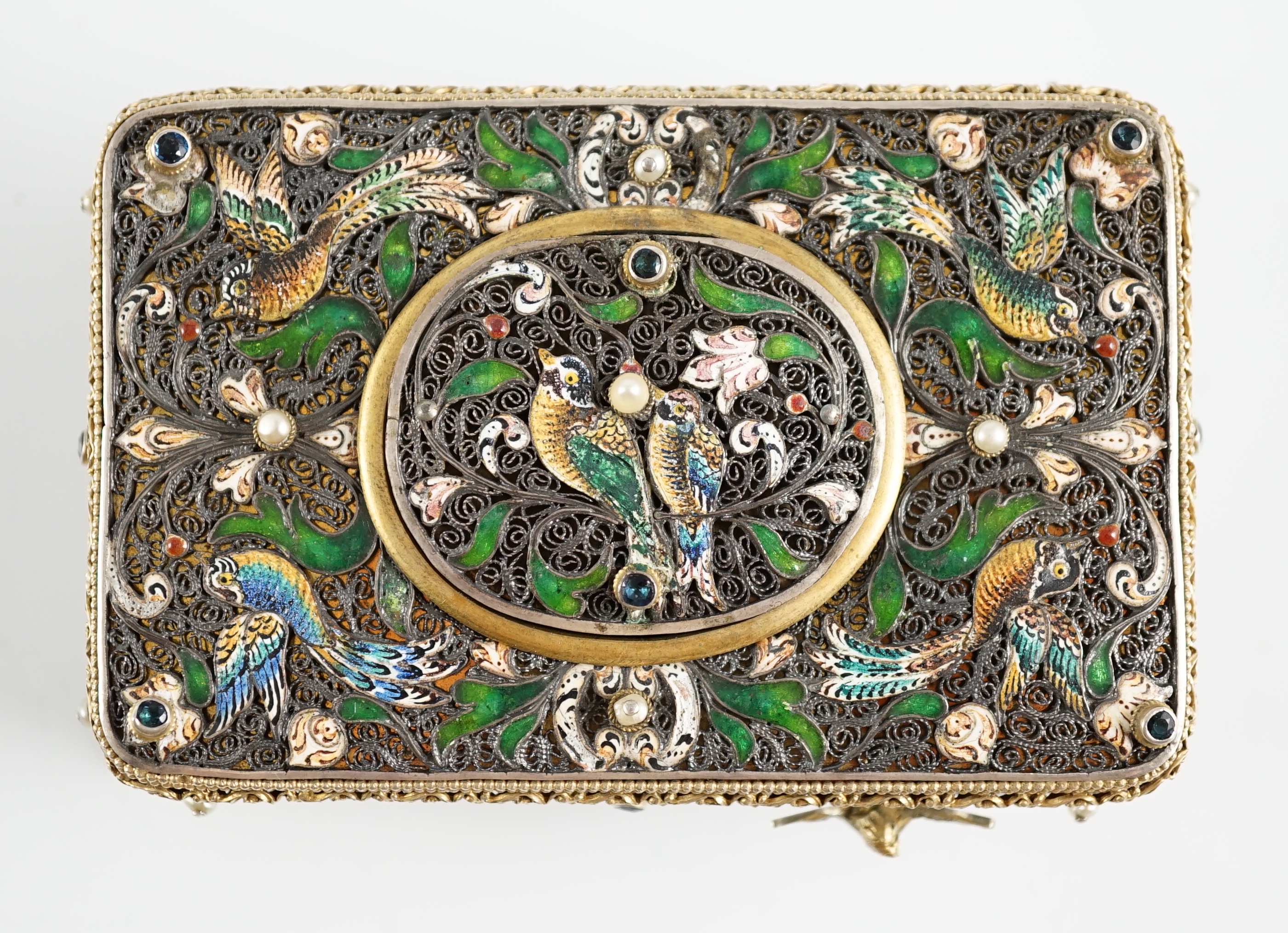 A 19th century Austro-Hungarian 800 standard silver gilt, jewelled and enamelled rectangular singing bird box automaton